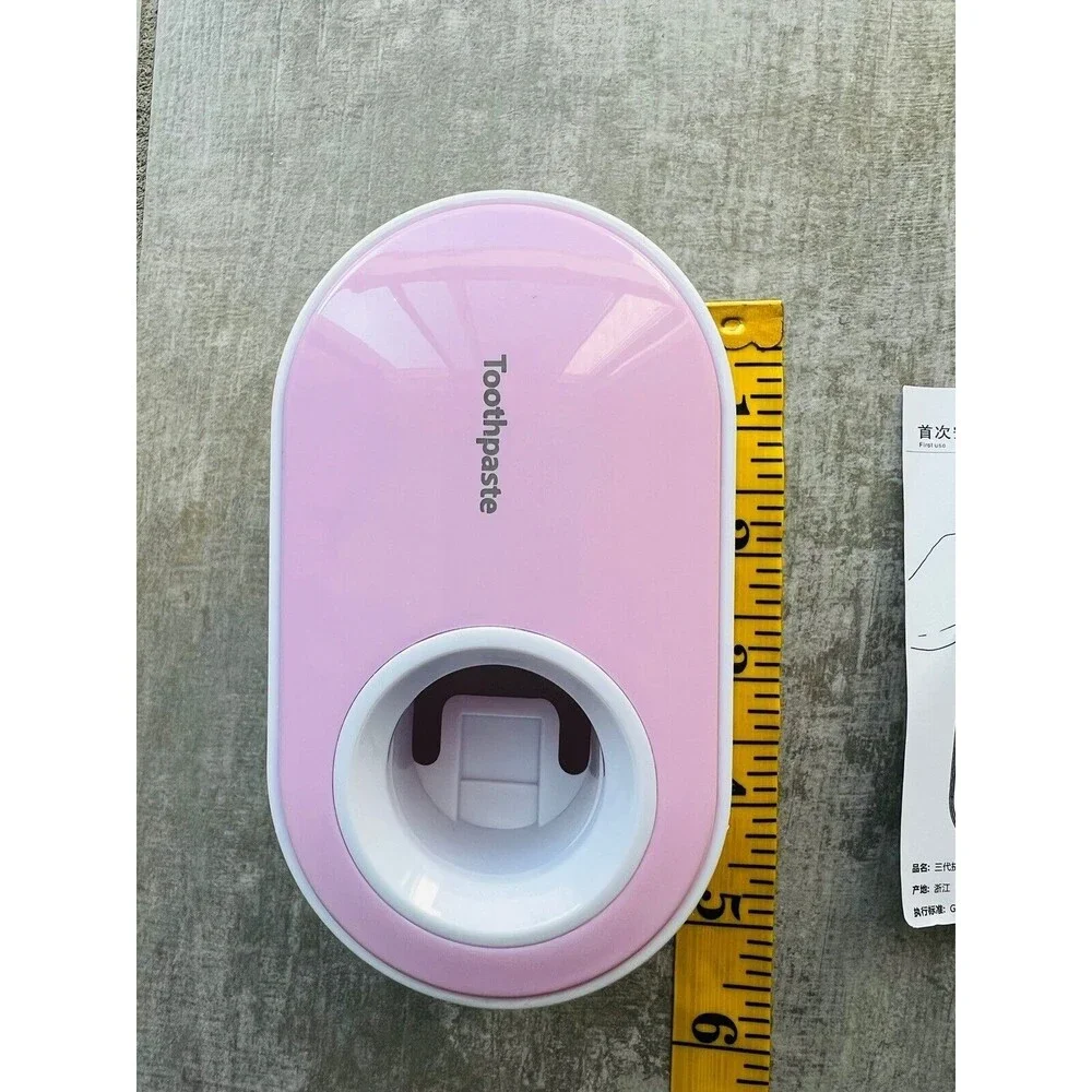 Pink Automatic Toothpaste Squeezer Wall Mounted Dispenser Bathroom Organizer NEW